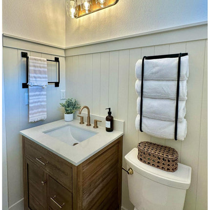 Here's your alt text for that image:      Matte black steel wall mount hooks styled with hanging towels in a clean farmhouse bathroom — Industrial Farm Co