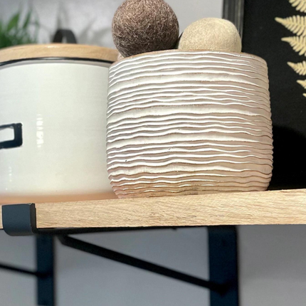 Floating shelf decorated with handpicked items