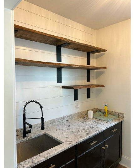 Industrial Farm Co Lorraine L black steel shelf brackets supporting rustic wood shelves in modern farmhouse kitchen with g...