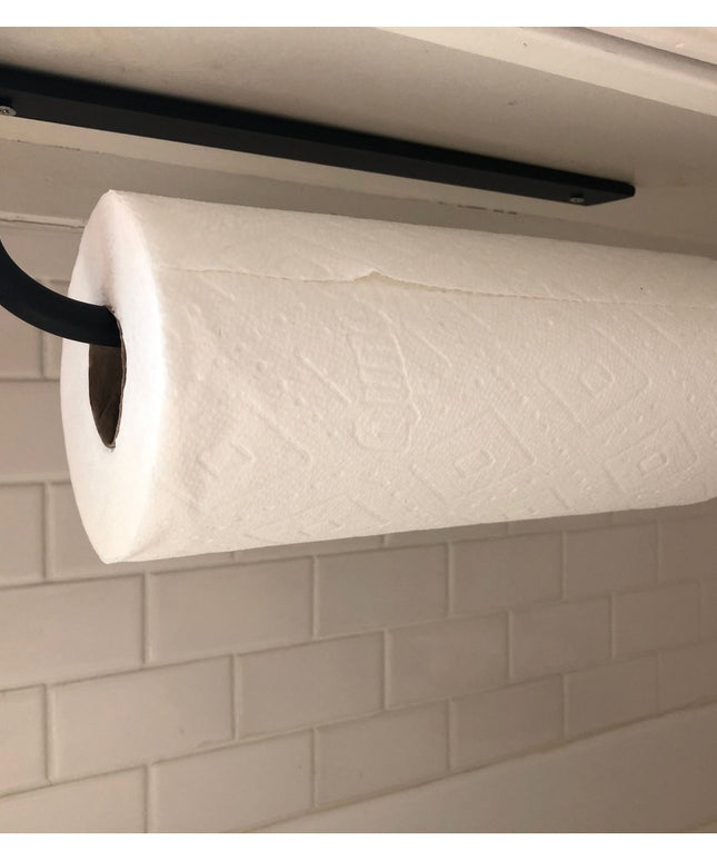 Black metal under-cabinet paper towel holder from Industrial Farm Co mounted beneath white cabinet with white paper towel ...