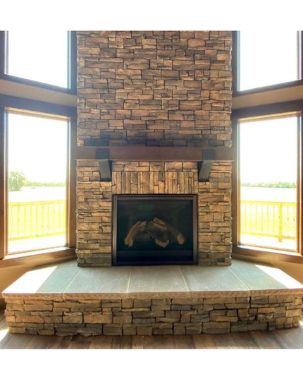 Rustic wooden Otisco Farmhouse Style Bracket supporting stone fireplace mantel with stacked stone surround and large windows