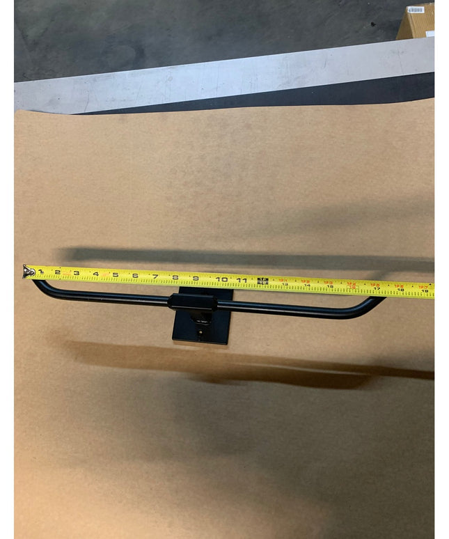 Black metal Fortworth towel bar by Industrial Farm Co with central mounting bracket, measured at 16 inches wide with yello...