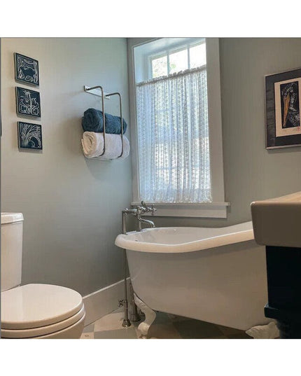 Black metal Tyler Bathroom Towel Rack by Industrial Farm Co mounted on gray wall holding blue and white towels in modern b...