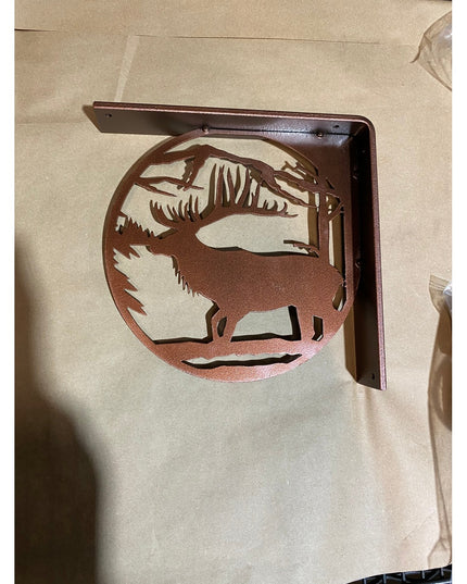 Handcrafted copper-finished metal elk silhouette L-bracket shelf support by Industrial Farm Co showing rustic wildlife des...