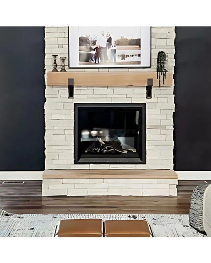 Seneca 3" black iron farmhouse mantel brackets supporting natural wood mantel on white stone fireplace by Industrial Farm Co