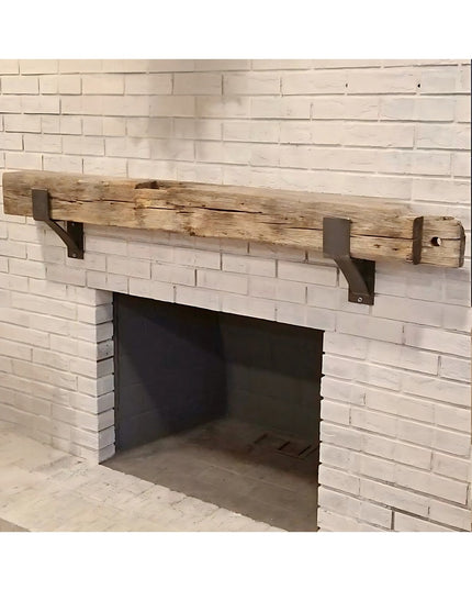 Industrial Farm Co Seneca 3" black metal farmhouse mantel brackets supporting reclaimed wood beam on white brick fireplace