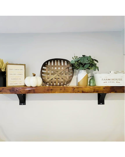 Heavy duty black steel industrial shelf brackets supporting rustic wood floating shelf with farmhouse decor - Industrial F...