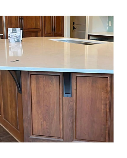 Heavy duty steel Dibbles 3" industrial shelf bracket with curved support bar installed under cream countertop with brown w...