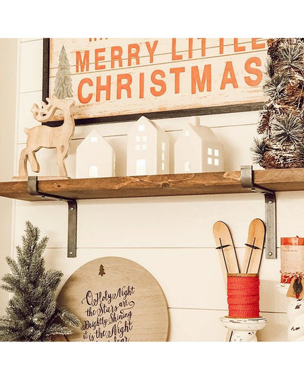 Industrial Farm Co Abbey Z Style black metal shelf brackets supporting rustic wood shelf with Christmas decor including wh...