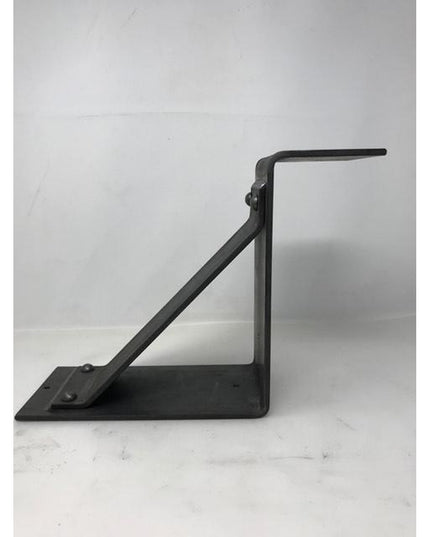 Black metal Monroe Style Corbel Bracket by Industrial Farm Co with triangular support design and mounting plate on white b...