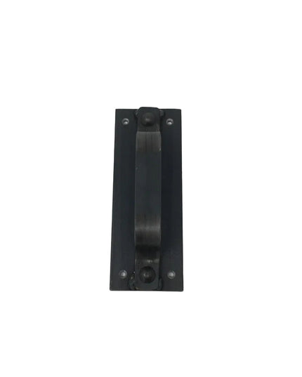 Black metal door handle called The Corning Handle by Industrial Farm Co, rectangular backplate with center pull bar and vi...