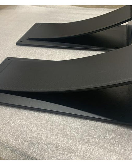 Black metal Cicero Bar Shelf Supports brackets by Industrial Farm Co showing curved corbel design with mounting holes on w...