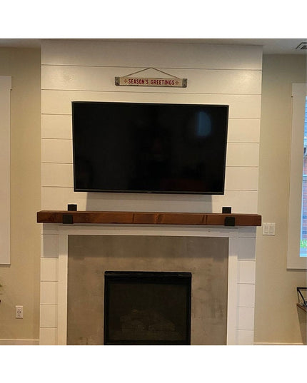 Black steel J-bracket shelf supports holding rustic wood mantel above white shiplap fireplace - Industrial Farm Co Dudley ...