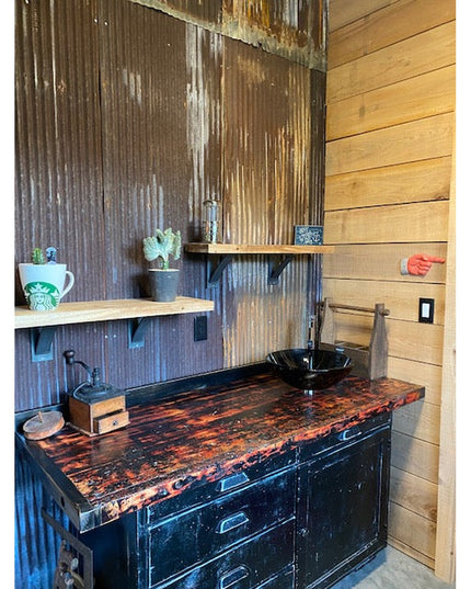 Rustic bathroom vanity with dark wood countertop featuring Industrial Farm Co Dibbles 3" black steel shelf brackets suppor...