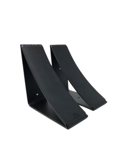Two black steel Eleanor Minimal Brackets by Industrial Farm Co showing curved triangular design with mounting holes on whi...
