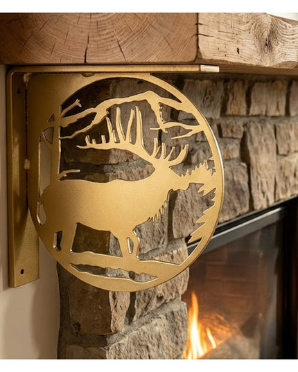 Handcrafted golden metal elk profile L-bracket shelf support mounted on rustic wooden beam above stone fireplace by Indust...