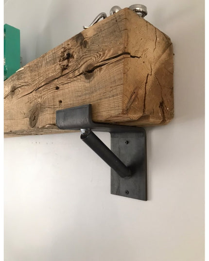 Rustic reclaimed wood beam floating shelf mounted on black metal bracket support from Industrial Farm Co, showing natural ...