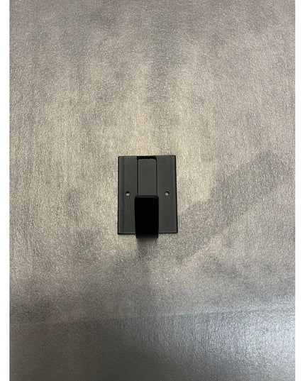 Black metal Dublin Mudroom Hook by Industrial Farm Co mounted on textured gray wall, featuring industrial square backplate...