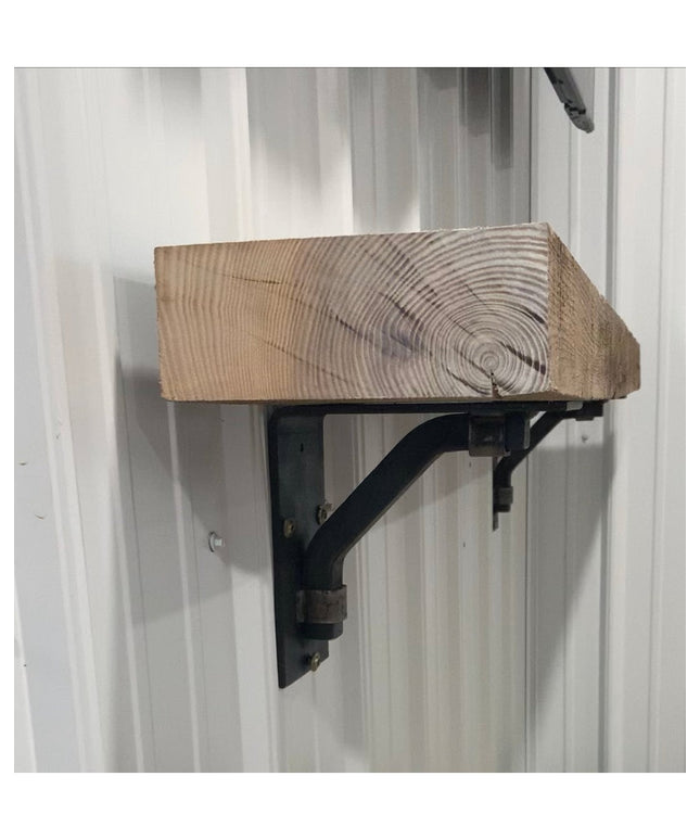 Black metal Rosamond shelf bracket supporting rustic wood beam shelf mounted on white wall, Industrial Farm Co decorative ...