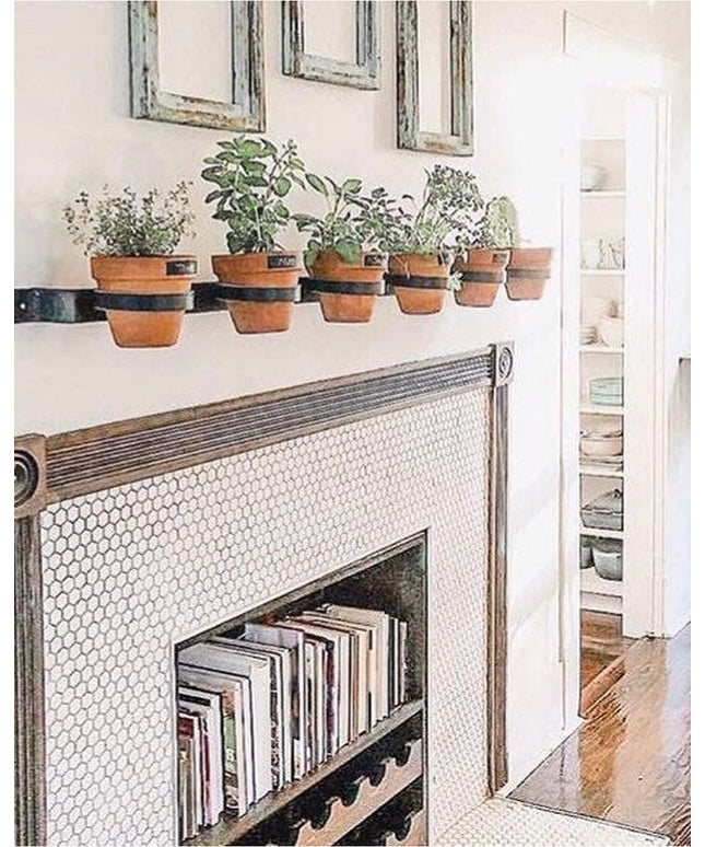 Yonkers Horizontal Steel Planter by Industrial Farm Co mounted on white fireplace mantel holding six terracotta herb pots ...
