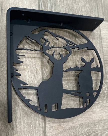 Black metal L-bracket shelf support featuring laser-cut deer and mountain landscape silhouette design by Industrial Farm C...