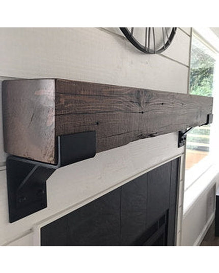 Monroe Style Corbel Bracket in dark wood finish supporting rustic beam mantel above white fireplace by Industrial Farm Co