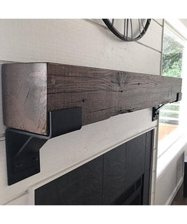 Monroe Style Corbel Bracket in dark wood finish supporting rustic beam mantel above white fireplace by Industrial Farm Co
