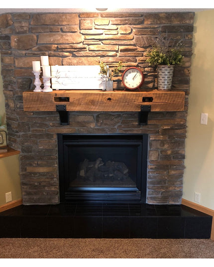 Heavy duty steel mantel brackets with rivets supporting rustic wood beam mantel on stone fireplace - Industrial Farm Co Mo...