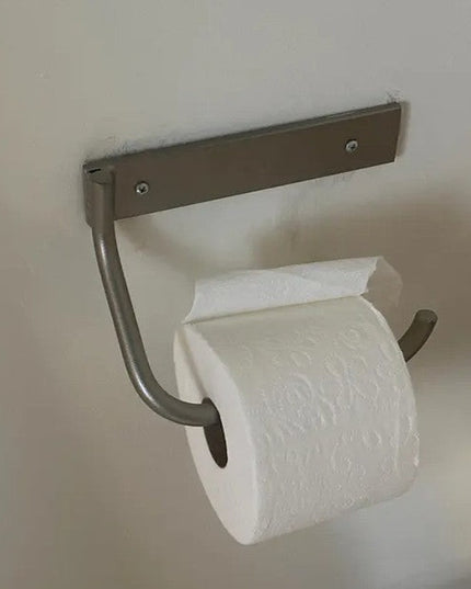 Industrial Farm Co Howlett Hill wall-mounted toilet paper holder in brushed steel with rectangular mounting plate and curv...