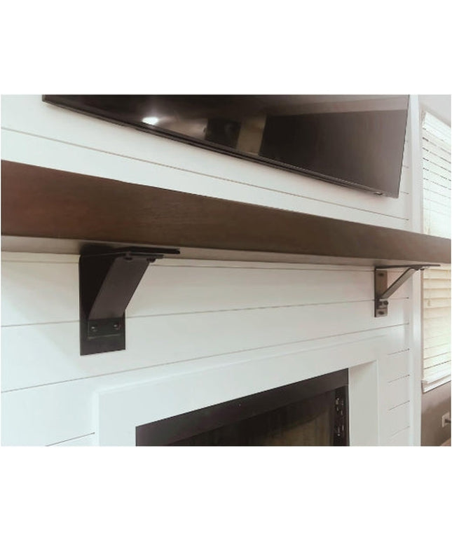 Black metal Ithaca Rustic Bracket Support by Industrial Farm Co mounted on white shiplap wall supporting wooden shelf