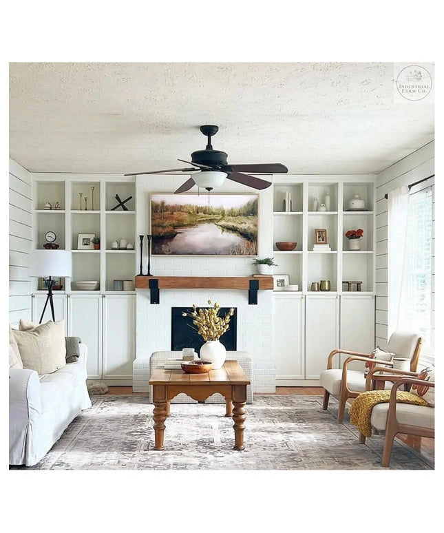Industrial Farm Co Clermont black steel mantel brackets with rivets supporting wood beam mantel in modern farmhouse living...