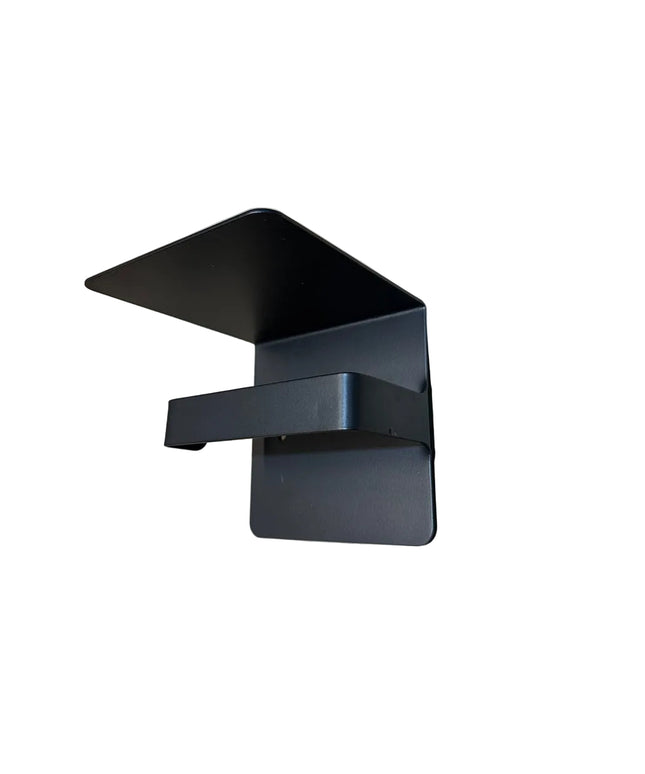 Black metal Cazenovia toilet paper holder with shelf by Industrial Farm Co mounted on white wall, featuring modern industr...