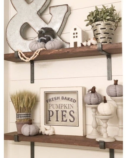 Black metal Z-style shelf brackets supporting rustic wood shelves with fall pumpkin decor and farmhouse accessories from I...