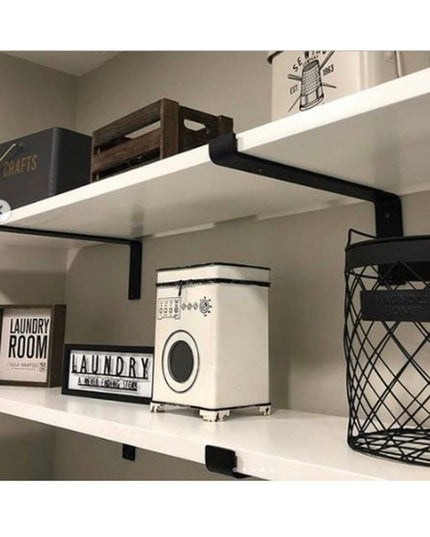 Black Z-style steel shelf brackets supporting white floating shelves in organized laundry room with storage baskets and de...