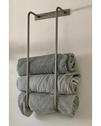The Tyler Bathroom Towel Rack by Industrial Farm Co - wall-mounted bronze metal towel holder with three gray folded towels...