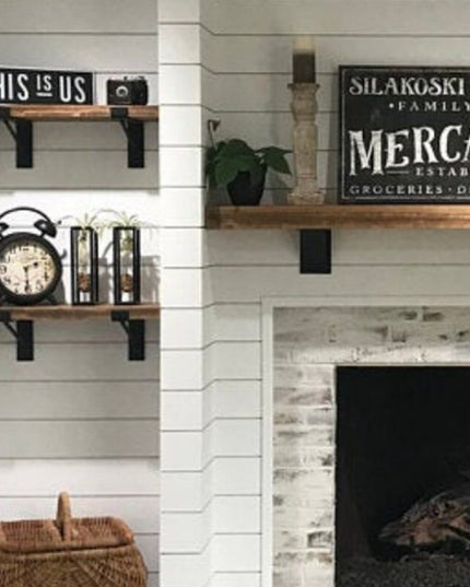Black metal Nauseef Shelf Support Brackets by Industrial Farm Co holding wooden shelves on white shiplap wall with farmhou...