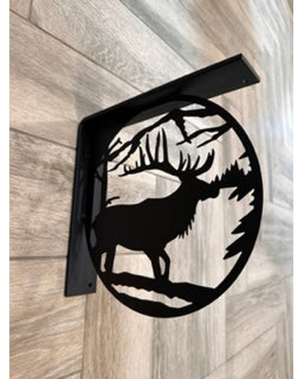 Black metal elk silhouette L-bracket shelf support by Industrial Farm Co mounted on light wood wall showing decorative wil...