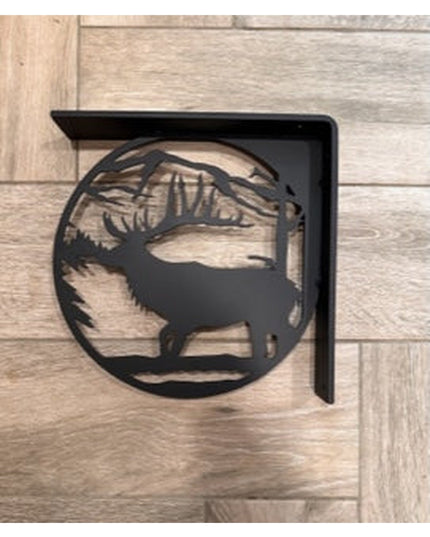 Black metal L-bracket shelf support featuring handcrafted elk silhouette design with antlers and mountain landscape cutout...