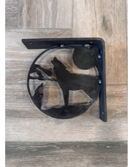 Black metal wolf silhouette shelf bracket by Industrial Farm Co mounted on light wood surface showing handcrafted decorati...